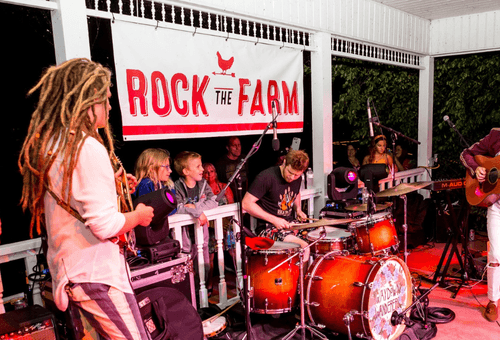 Rock The Farm event banner with band in Makinaw, IL